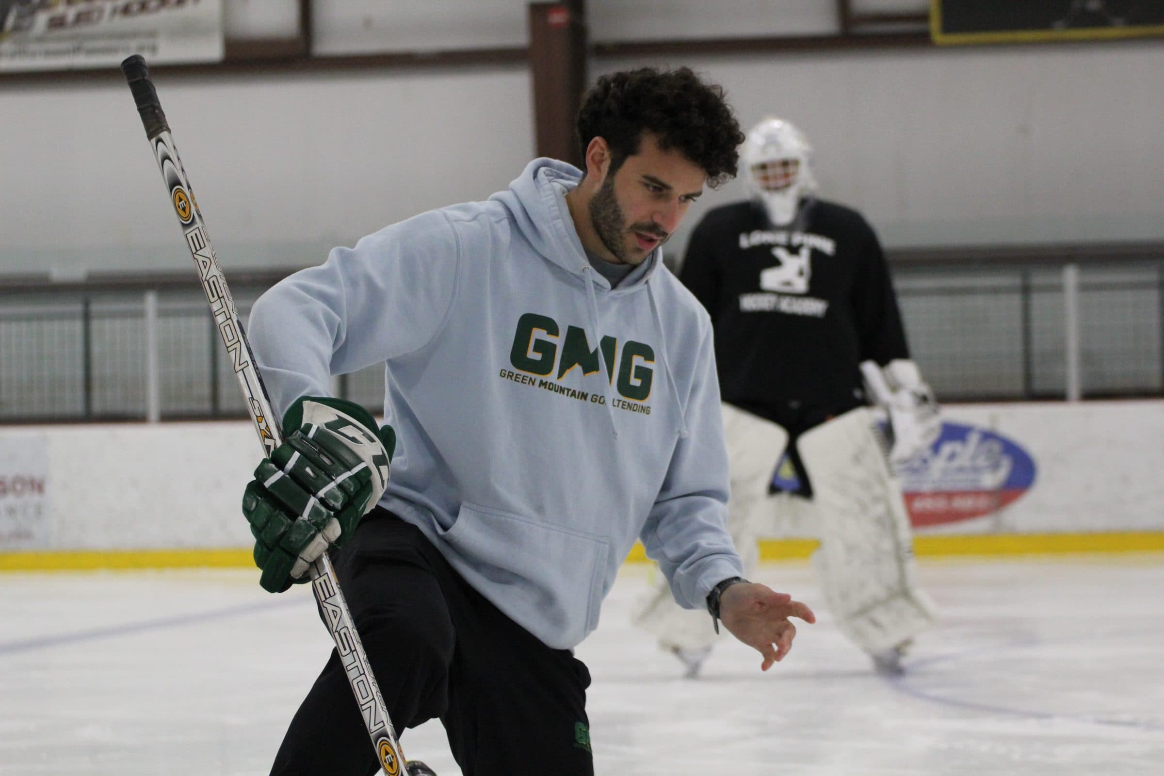 Coach Shea breaking down a movement on the ice
