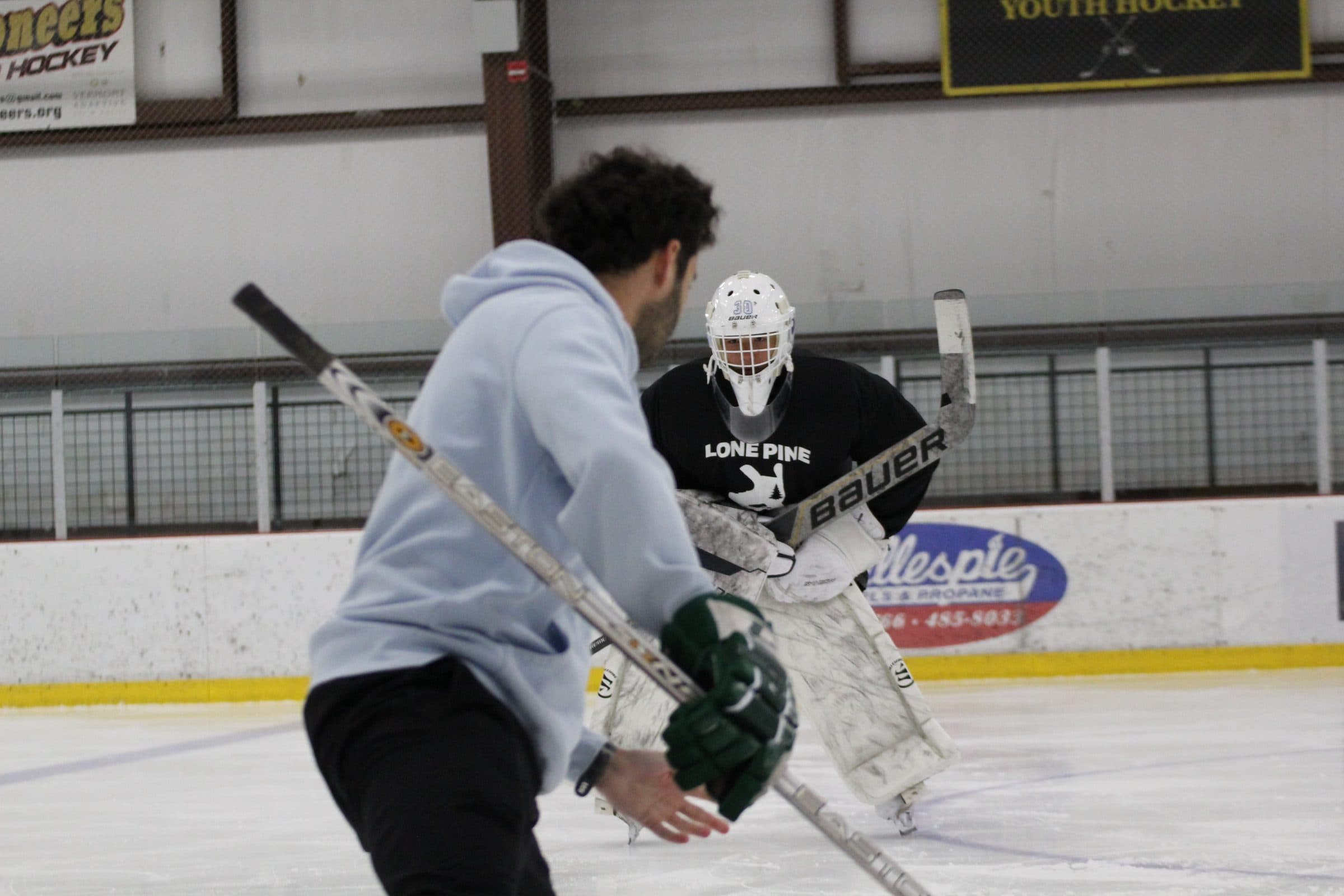 Coach Shea working a goalie through a stance drill